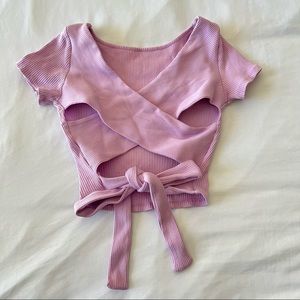 Cute light pink crop top with a criss cross tie on the back
